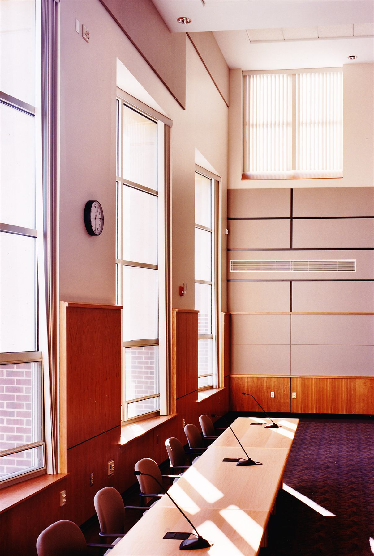 Bright assembly hall with tall windows